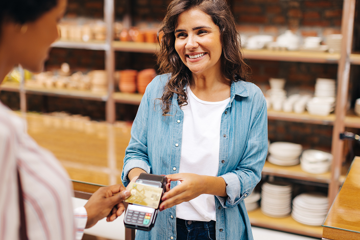 Woman paying at the store